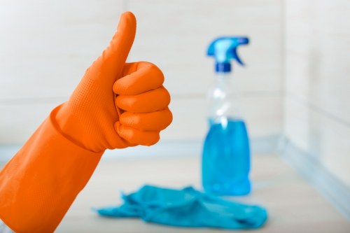 Technician preparing to clean a carpet with care and protective measures
